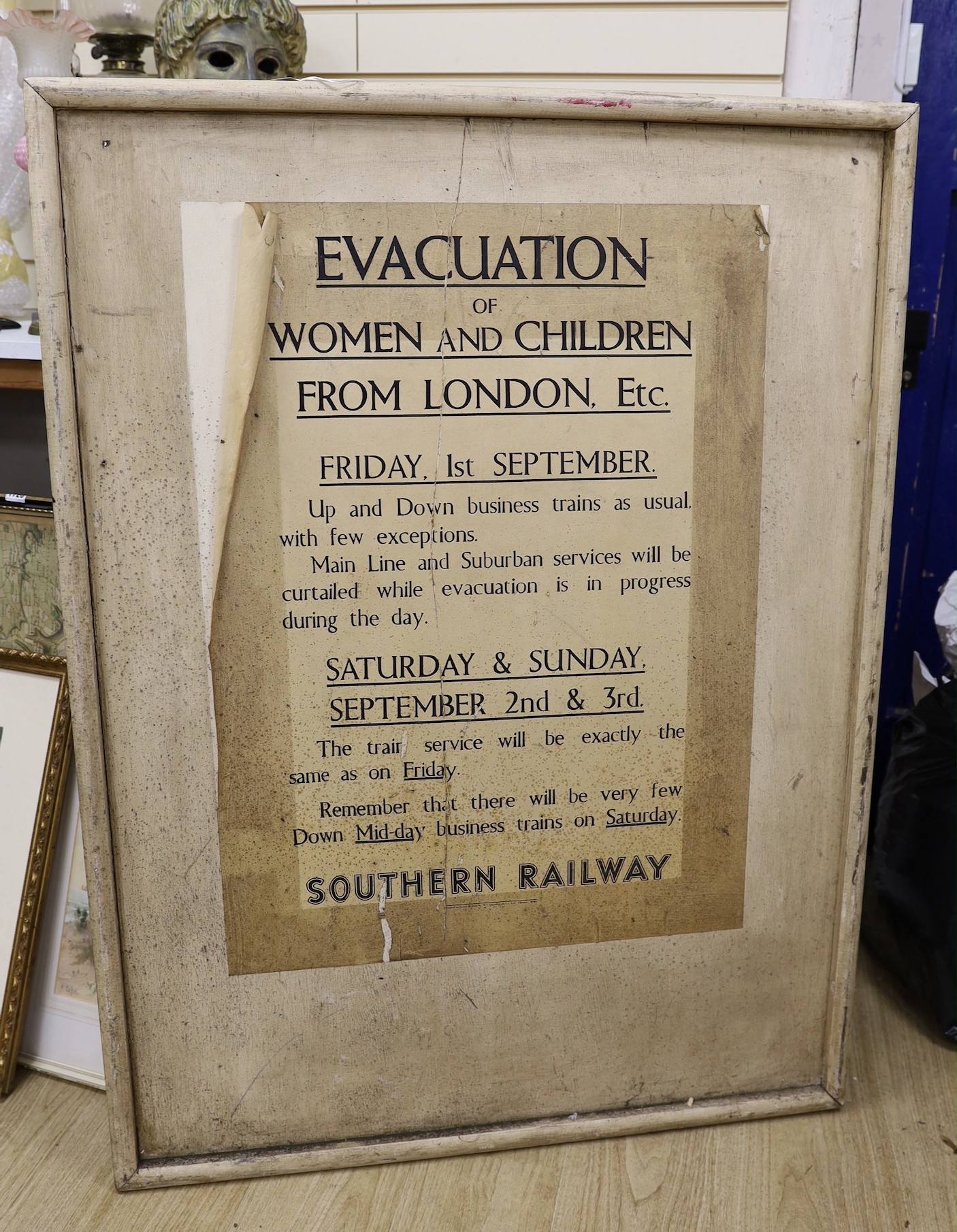 A World War Two Southern Railway Evacuation sign ‘Evacuation of women and children from London, Etc.’, wood mount 124 x 92cm, and five further metal signs